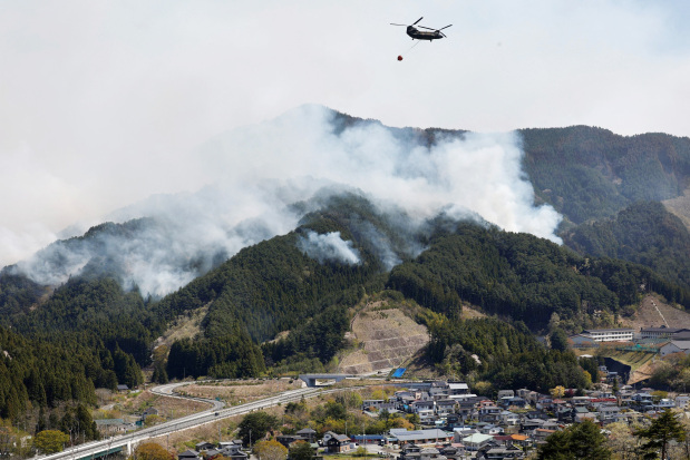 Japan deploys hundreds of firefighters as blazes rage